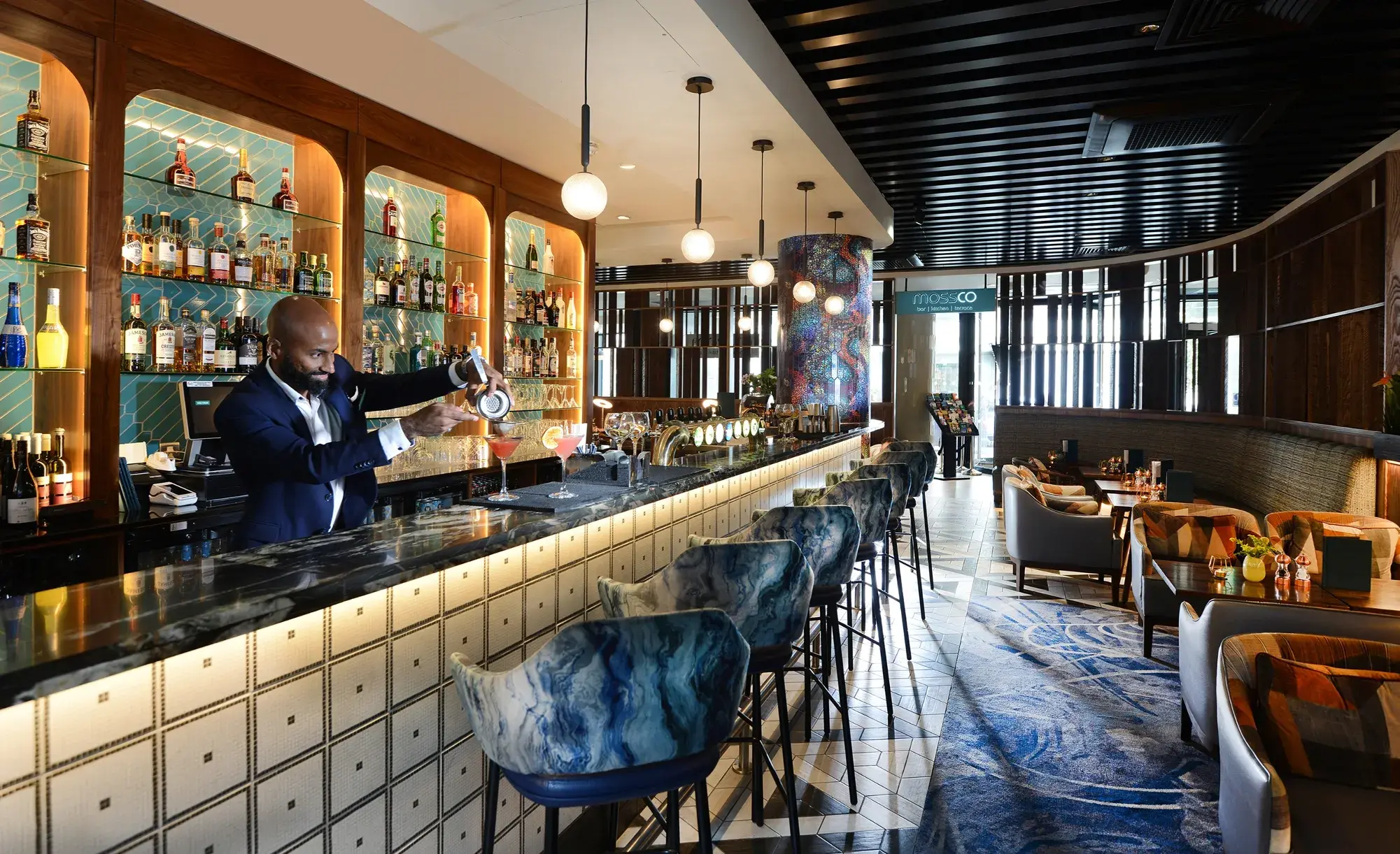 Bartender preparing a cocktail at Mossco