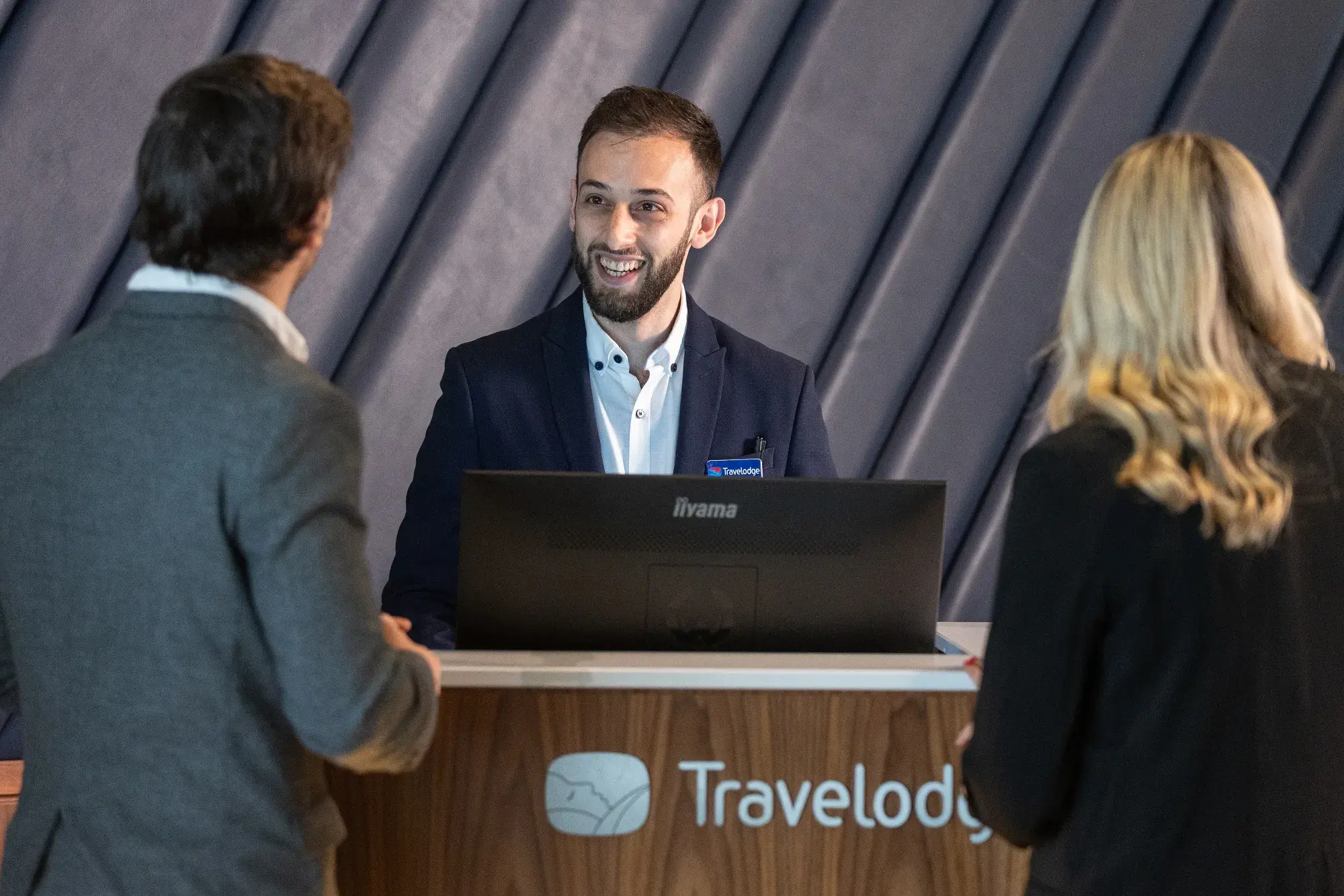 Guests checking in at the Travelodge front desk
